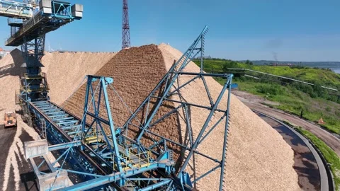 Drying and storage of wood chips in piles. General view of the paper mill Stock Footage 321667920