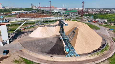 Drying and storage of wood chips in piles. General view of the paper mill Stock Footage 321669883