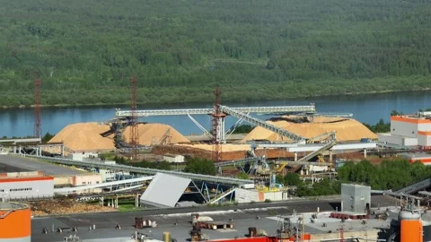 Drying and storage of wood chips in piles. General view of the paper mill Stock Footage 321672247