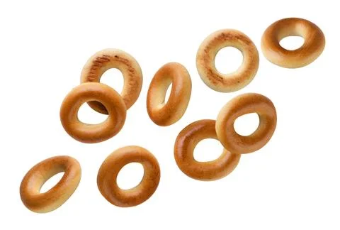 Drying bagels fly on a white background. Isolated Stock Photos