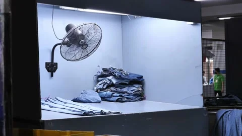 Drying Box With Fan Spinning With Jeans Laid Out Flat In Factory In Stock Footage 197817191
