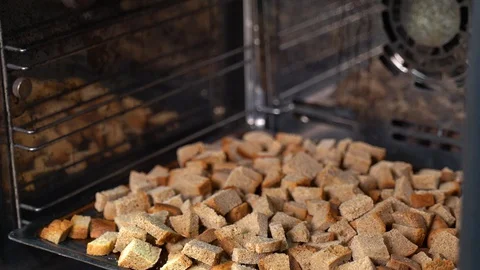 Drying bread in the oven. Manufacture of crackers. Stock Footage 129532944