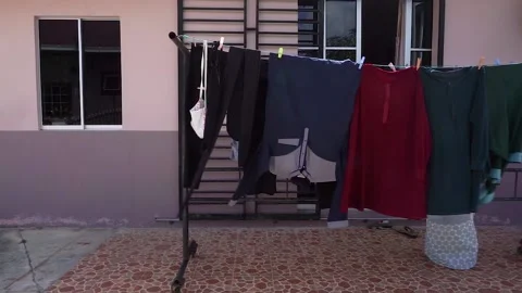 Drying the cloth under the sun Stock Footage 131024427