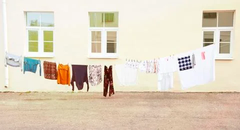 Drying clothes and clothes after washing in the open air Stock Photos