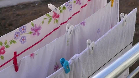 Drying clothes on the balcony,the balcony is drying bed linens. 스톡 동영상 121889337