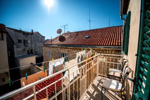 Drying clothes at the balcony Stock Photos