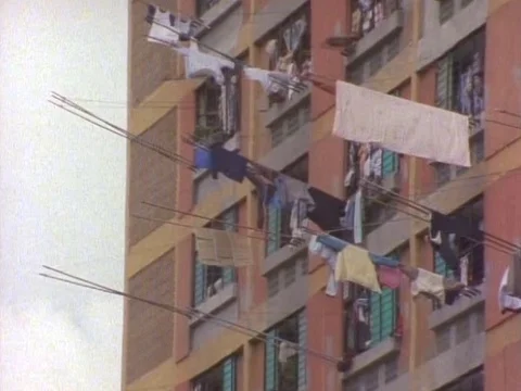 Drying clothes hanging outside the window of an building Video stock 79878765