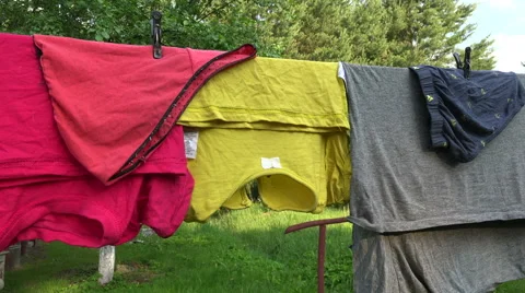 Drying clothes in homestead, 4K Stock Footage 64705850