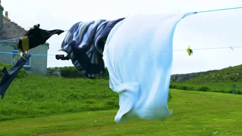 Drying Clothes on the Loundry Line, Slow Motion, Windy Day Stock Footage 156303692