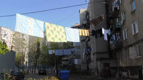 Drying clothes in a multi-storey building. Yard on the outskirts of Odessa. Stock Photos