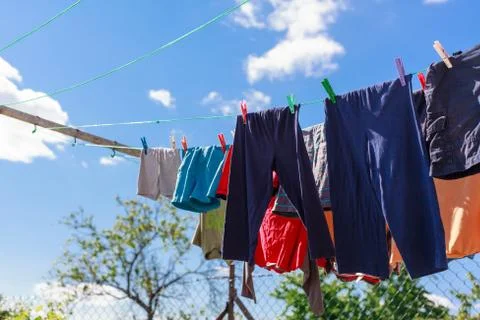 Drying clothes outdoors. Stock Photos