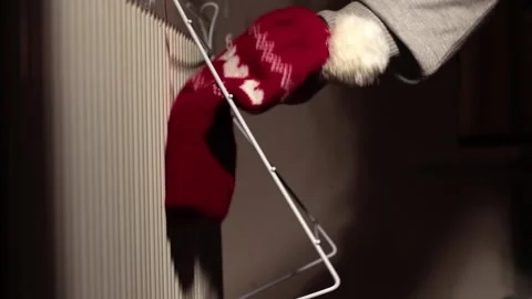 Drying clothes over radiator drying rail Stock Footage 261510569