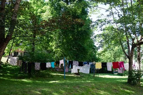 Drying clothes summer in the backyard of the house in the garden Stock Photos