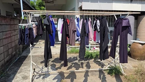 Drying clothes in weekend. Hung washed clothes under sunny. Video stock 307733483