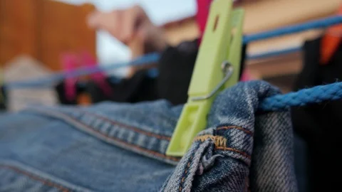 Drying clothes in the wind with clothespins on a rooftop terrace Video stock 124646474