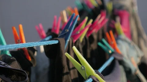 Drying clothes in the wind with clothespins on a rooftop terrace Stock Footage 124646582