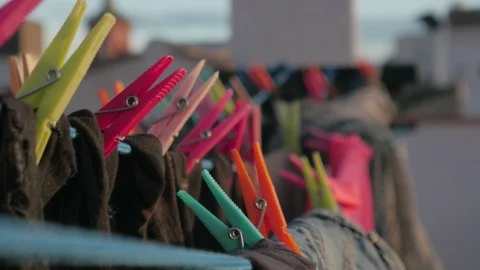 Drying clothes in the wind with clothespins on a rooftop terrace Stock Footage 124646903