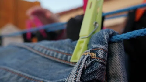 Drying clothes in the wind with clothespins on a rooftop terrace Video stock 124651114