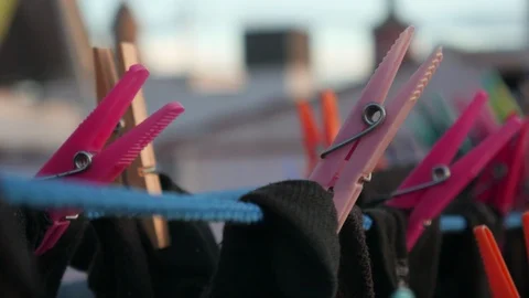 Drying clothes in the wind with clothespins on a rooftop terrace Stock Footage 124651208