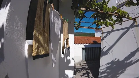 Drying clothes on window in sunny and windy day Video stock 88798333