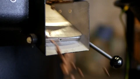 Drying coffee beans after roasting pour in the packer, juicy close-up Stock Footage 129400831