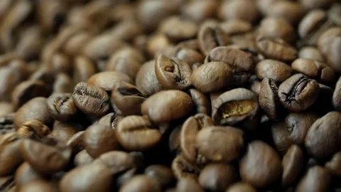 Drying coffee beans after roasting, juicy close-up, wavy move, roaster Stock Footage 129400882