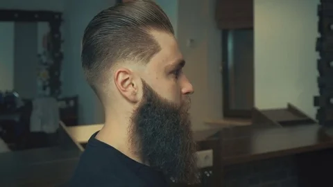 Drying hair with blow dryer of man client Stock Footage 71705053