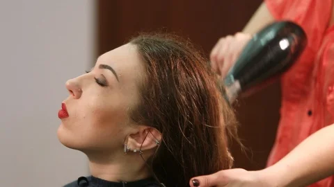 Drying with a hair dryer Stock Footage 128988796
