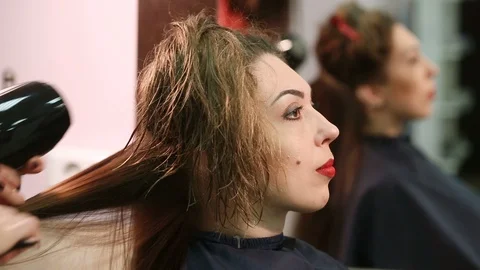 Drying with a hair dryer Stock Footage 128988933
