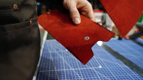 Drying leather glue edge before stitching wallet Stock Footage 314961741