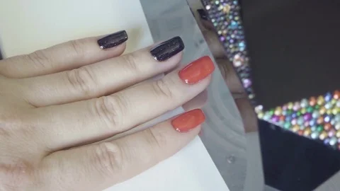 Drying the nail polish in the lamp Stock Footage 72981170