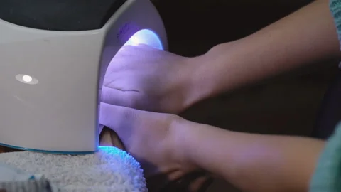 Drying of nails with ultraviolet Stock-Footage 93847670