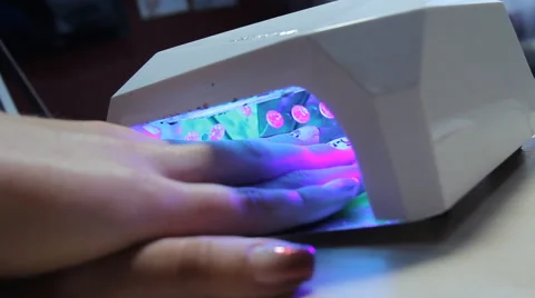 Drying nails in the UV Lamp Nail Dryer Machine. Stock Footage 63458284