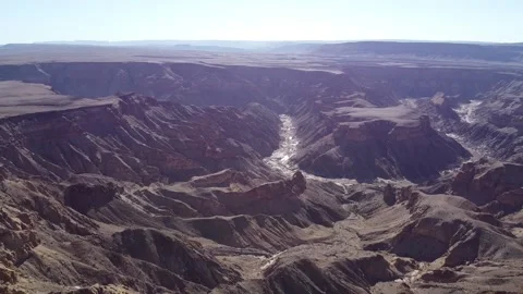 Drying river in the middle of a huge canyon, Namibia, Fish River Canyon Stock Footage 132865745