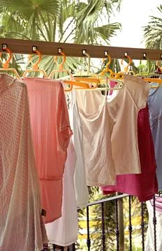 Drying washed cloths on balcony Stock Photos