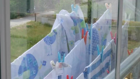 Drying the washed laundry on the balcony, 스톡 동영상 132761855