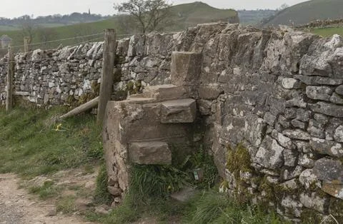 Drystone wall with stone sty Stock Photos