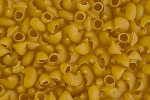 Dry,Uncooked Shape Pasta Background,top view,flat layout. Stock Photos