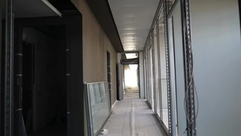 Drywall framing corridor under construction with metal stud walls Stock Footage 332584365