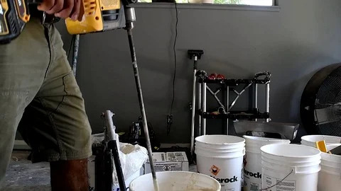 Drywall mixing compound close up Stock Footage