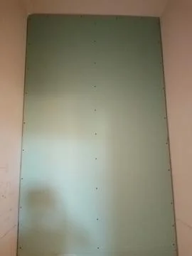 Drywall partition constructed using moisture-resistant boards. Stock Photos