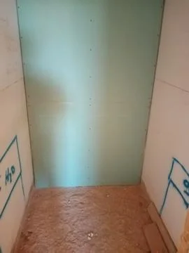 Drywall partition constructed using moisture-resistant boards. Stock Photos