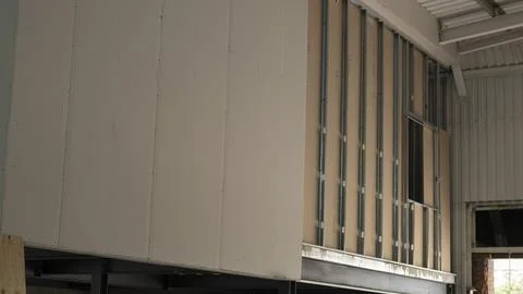 Drywall partition construction metal stud framing mezzanine office interior.. Fotos Stock