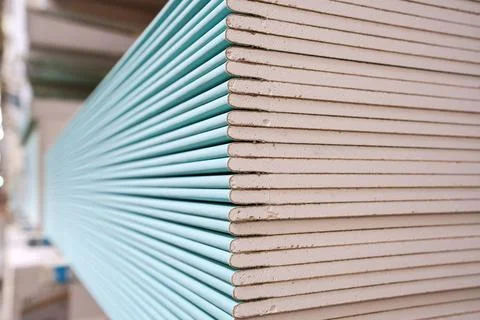 Drywall sheets stacked in a construction materials store Stock Photos