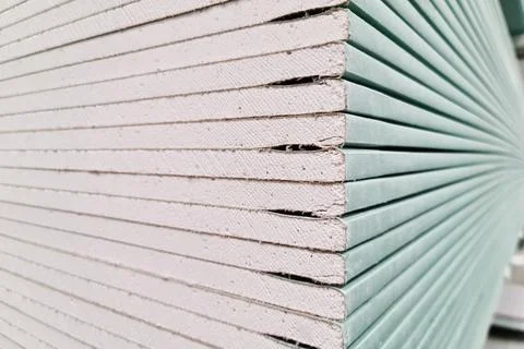 Drywall stacked in stacks at a hardware store, close up Stock Photos