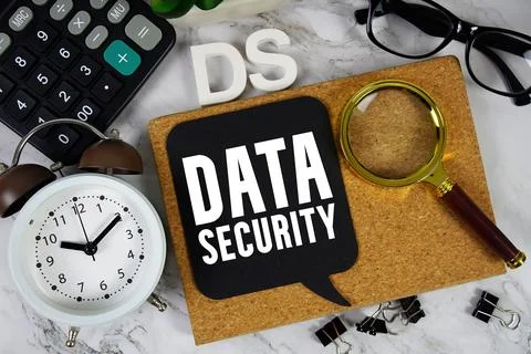 DS Data Security text with Calculator, alarm clock and magnifying glass on .. Foto stock