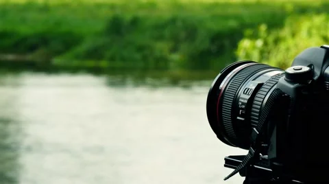 Dslr cam with river in background Video stock 42125757