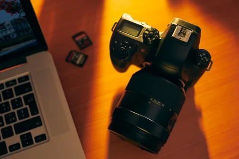 Dslr Camera And SDHC Memory Cards On Desk Near PC Stock Photos