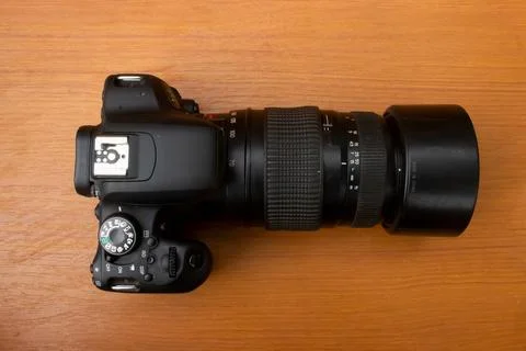 Dslr camera on brown background Stock Photos