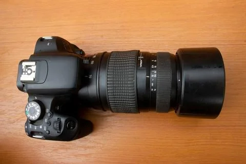 Dslr camera on brown background Stock Photos